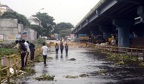 The Cooum river overflows from the causeway at Adayalampattu due to recent rains.