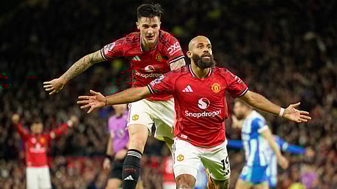 Bryan Mbeumo runs to celebrate as Manchester United extend their lead over Brighton.