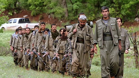A group of armed Kurdish fighters from the Kurdistan Workers Party (PKK) enter northern Iraq in the Heror area, northeast of Dahuk, 430 kilometers northwest of Baghdad, Iraq, May 14, 2013.