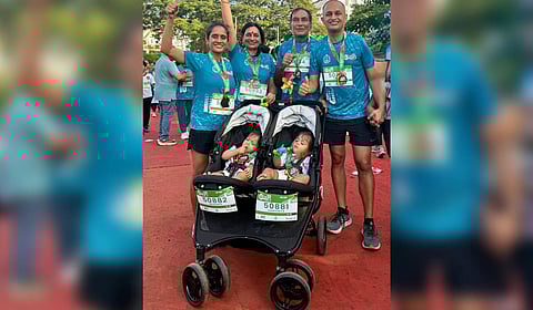 Samyukta and Akshara with their family at Spice Coast Marathon.