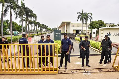 In this image from Sep. 27, 2025, Tamilaga Vettri Kazhagam chief and actor Vijay addresses a gathering before a stampede during a public event, in Karur.