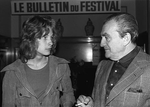 Italian director Luchino Visconti (right) chats with young Swedish actor Bjorn Andresen in Cannes, during the international film festival in 1971. (Photo | AFP)