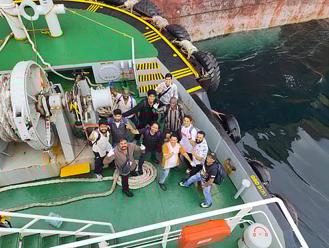 The crew members of the Liberia-flagged cargo vessel aboard the tug boat at Vizhinjam Port.