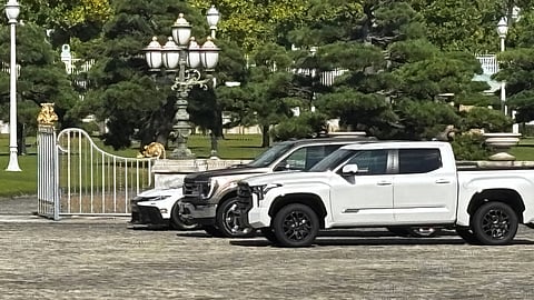 A Ford F-150, center, and two other American-made cars sit parked outside the Akasaka Palace, Tokyo's guest house for visiting foreign leaders, in Minato, Japan, Monday, Oct. 27, 2025, as President Donald Trump meets Japan's Prime Minister Sanae Takaichi.