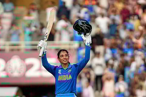 India's Smriti Mandhana celebrates her century during the ICC Women's Cricket World Cup cricket match between India and New Zealand at DY Patil Stadium in Navi Mumbai, India, Thursday, Oct. 23, 2025. 
