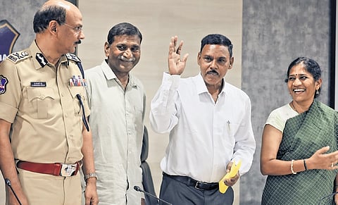 Two senior CPI (Maoist) leaders Pulluri Prasad Rao and Bandi Prakash surrender before Telangana DGP B Shivadhar Reddy in Hyderabad on Tuesday.
