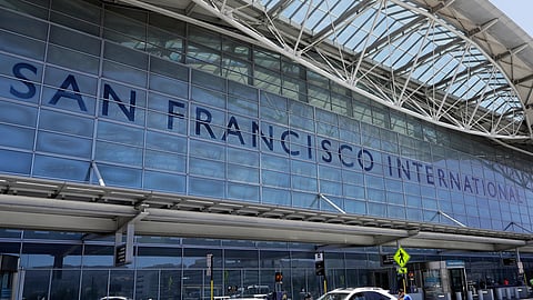 FILE - Vehicles wait outside the international terminal at San Francisco International Airport in San Francisco, July 11, 2017.