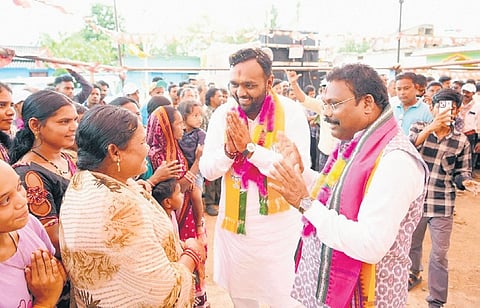 Minister Gokulananda Mallik and BJP candidate Jay Dholakia meeting voters.