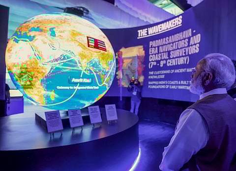 Prime Minister Narendra Modi visits a stall at an exhibition during the Maritime Leaders Conclave at the India Maritime Week 2025 event, in Mumbai.