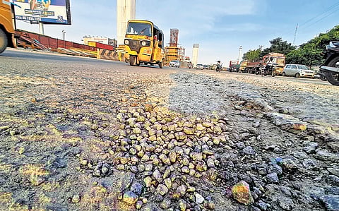 A damaged portion of the road on the NH section in Maduravoyal.