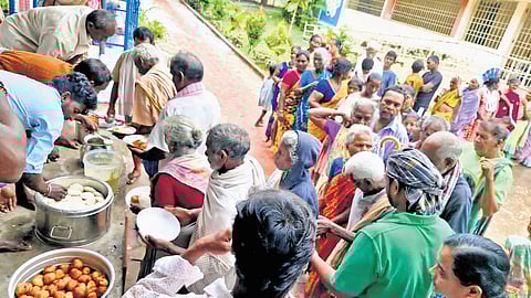 Breakfast being served to residents in a cyclone-hit area at Thallarevu.
