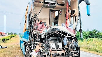 The mangled passenger bus.