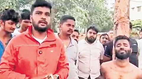 Locals caught him, tied him to a tree, and thrashed him before handing him over to the police.