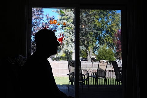 A customer walks into a bakery as a SNAP EBT information sign is displayed at the front door in Chicago, Sunday, Nov. 2, 2025.