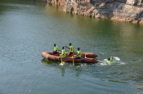 Firefighters search for the body of a 20-year-old welder who was allegedly strangled to death by his brother-in-law and his friend, and later dumped in an abandoned water-filled stone quarry at Melapattam in Tirunelveli on Thursday.