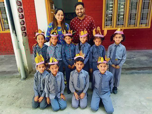 Jyoti and Shrey Rawat with students