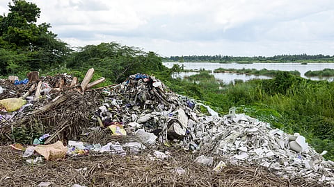 Construction waste and garbage dumped in the shore of Cauvery river at Ponnurangapuram near Tiruchy 