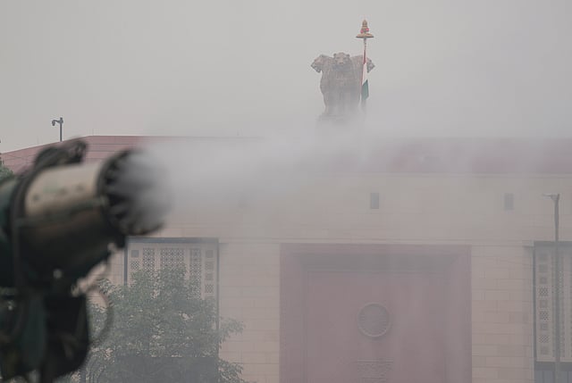 An anti-smog gun is being used to spray water droplets to curb air pollution, in New Delhi, Thursday, Oct. 30, 2025.