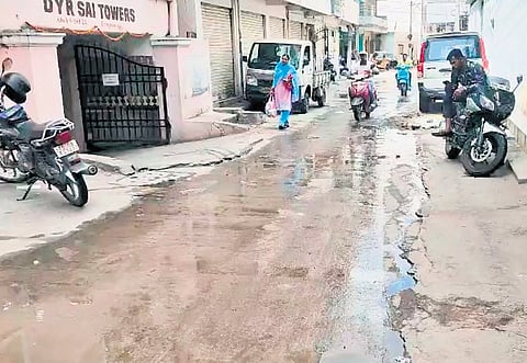 Sewage water from an open drain (inset) overflows onto the road in Erragadda on Friday.
