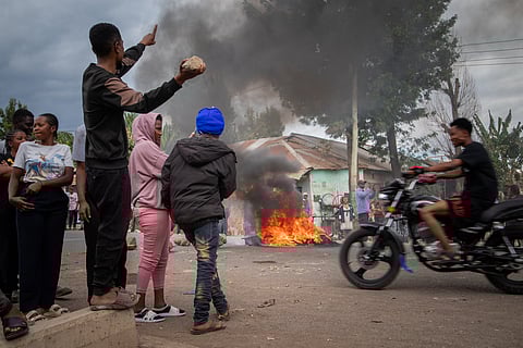 People protest in the streets of Arusha, Tanzania, on election day Wednesday.