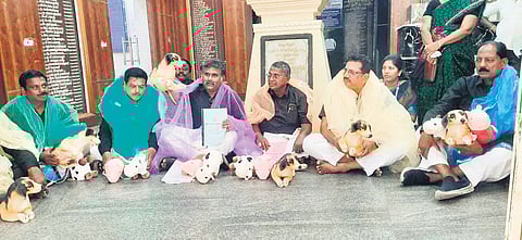 AIADMK councillors protest against inaction by the civic body in addressing key public issues, in front of the Tambaram Corporation on Friday 