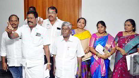 AIADMK councillors walking out of the Salem City Municipal Corporation council meeting on Friday. 