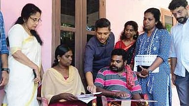 Officials accepting the first filled-out enumeration form in the state.
