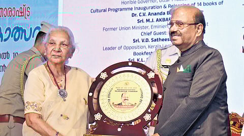 West Bengal Governor C V Ananda Bose receiving the Malayalaratnam Puraskaram from Uttar Pradesh Governor Anandiben Patel at the venue of the Kochi International Book Festival on Saturday.