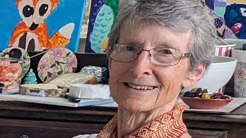 This undated photo provided by Katherine Rees Thursday, Oct 30, 2025 shows her mother, Suzanne Rees, posing for a photograph in Australia.