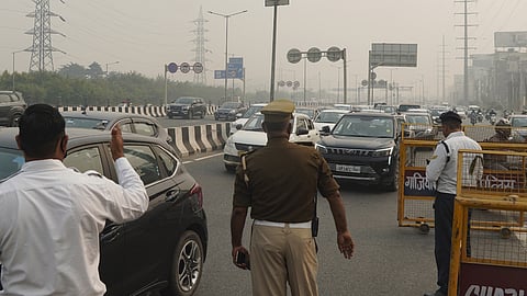 Traffic Police personnel deployed at Gazipur border amid imposition of the ban on the entry of all non-Delhi registered BS-III or lower