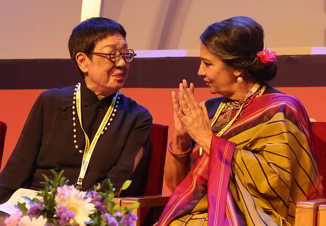 Actor Shabana Azmi with IFFK Lifetime Achievement Award winner and Hong Kong filmmaker Ann Hui during 29th IFFK at Nishagandhi auditorium
