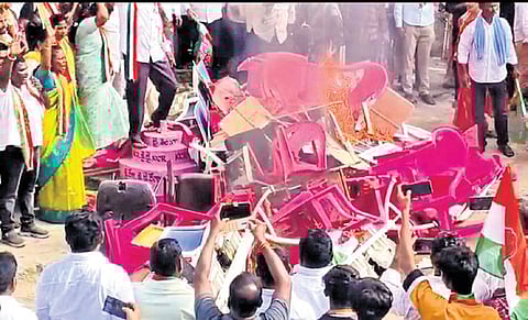 Led by local leaders, the Congress cadre barged into the office and burnt the furniture before hoisting the party flag on the building.