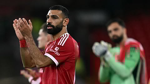 Liverpool's Egyptian striker Mohamed Salah applauds the fans following the EPL football match between Liverpool and Aston Villa at Anfield in Liverpool, north west England on November 1, 2025.