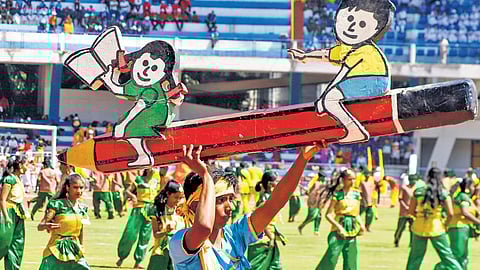 Students perform during Kannada Rajyotsava celebrations at Kanteerava Stadium, in Bengaluru, on Saturday.