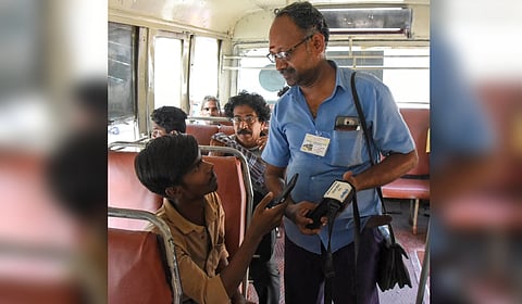 A conductor collecting bus fare via QR code transaction in Tiruchy on Saturday.