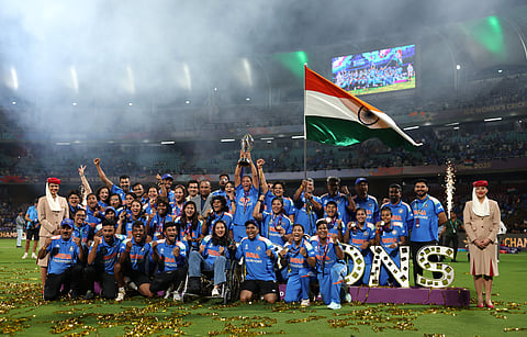 India's players pose with the trophy after their win over South Africa in the ICC Women's Cricket World Cup final match in Navi Mumbai, India, Sunday, Nov. 2, 2025.