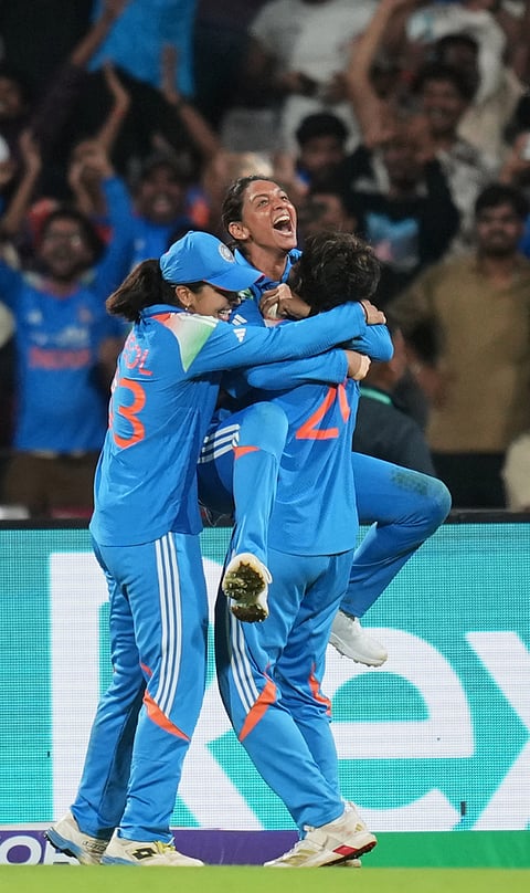 India's captain Harmanpreet Kaur, left, speaks with India's Kranti Goud during the ICC Women's Cricket World Cup final match between India and South Africa in Navi Mumbai, India, Sunday, Nov. 2, 2025. 