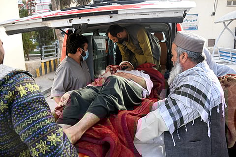 Afghan men assist an injured man into an ambulance in the aftermath of an earthquake, that struck overnight at Mazar-i-Sharif on November 3, 2025.
A 6.3-magnitude strong earthquake killed at least nine people in northern Afghanistan, authorities said on November 3, just months after another deadly tremor left the country reeling.