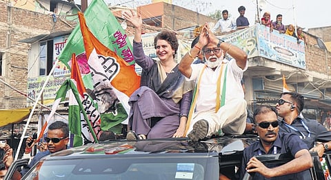 Congress general secretary Priyanka Gandhi Vadra during a roadshow in Samastipur on Monday as local residents look on from their rooftops.