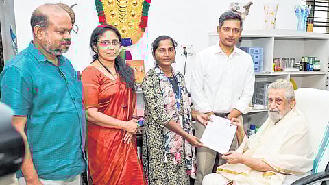 Chief Electoral Officer-Kerala Rathan U Kelkar and other poll officers presenting 
the enumeration form to veteran actor Madhu at his residence in Thiruvananthapuram on Tuesday 