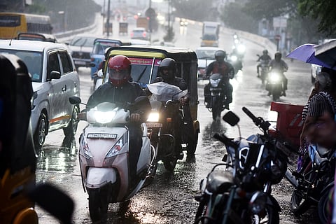 Motorists drive  through heavy rain at purasaiwalkam  in Chennai.