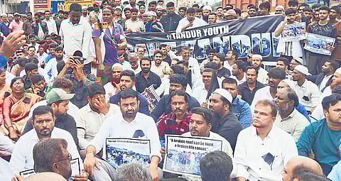 Tandur residents stage protest demanding repairs to the road to Hyderabad, in Vikarabad on Tuesday, Former MLA Pilot Rohith Reddy is also seen.