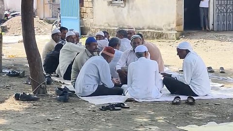 Family members gathered at deceased farmer's home