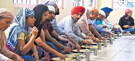 Langar being served at the gurdwara in Kochi on Wednesday