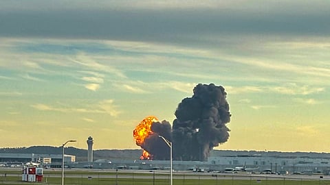 This handout photo courtesy of Levi Dean shows smoke and flames rising from the site of a UPS cargo plane crash outside Louisville International Airport in Louisville, Kentucky, on November 4, 2025.