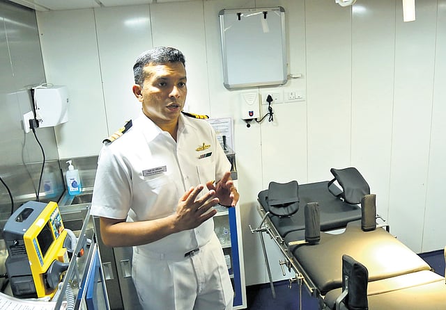 Principal Medical Officer Sergeant Commander Athul N Gopinath explaining the hospital facilities on board Ikshak