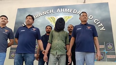 The accused, Imran, in police custody.