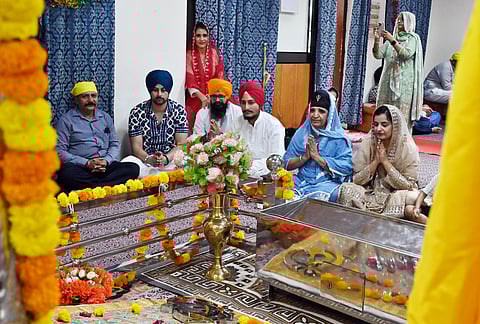 Devotees offer prayers at the gurdwara in Pangode Army Cantonment