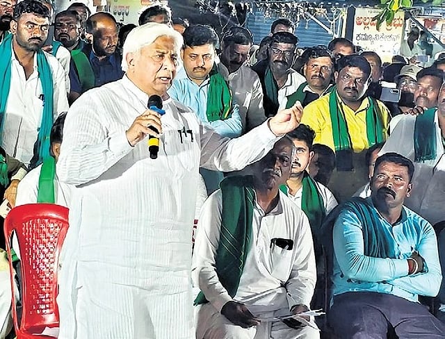 Minister HK Patil addresses the protesters on Wednesday evening.  
