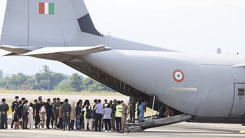 India nationals, believed to have worked at scam center in Myanmar, board a plane at Thailand's Mae Sot International Airport in Tak, before being sent back to India, Thursday, Nov. 6, 2025.
